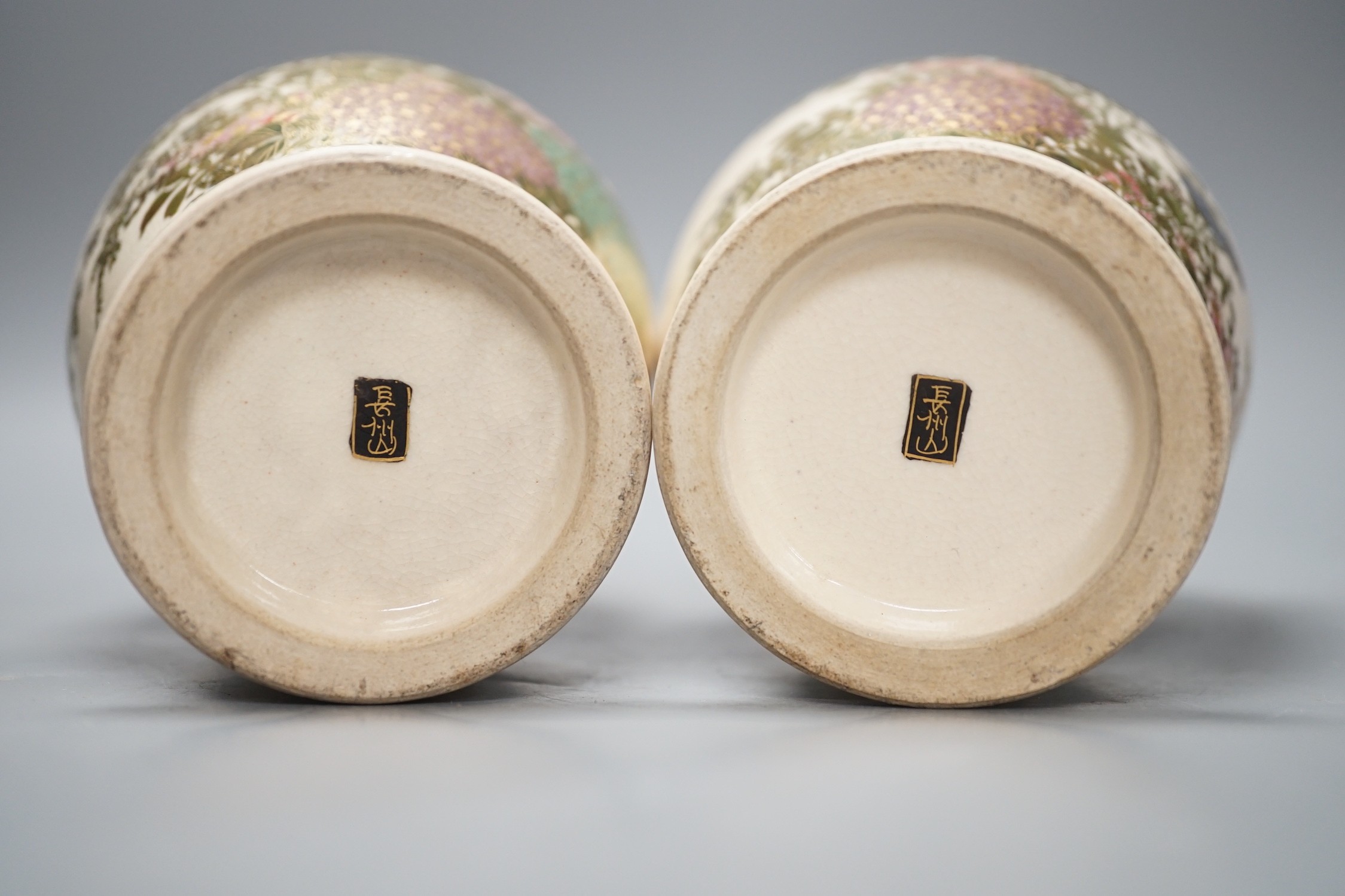 A pair of Japanese Satsuma pottery vases, 18.5cms high
